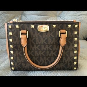 Small brown and tan Michael kors crossbody bag.